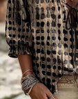 Lena | Blouse met stippenpatroon en vetersluiting