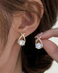 Oorbellen met gouden kruis en zirconia