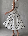 Zwart-witte klassieke polka dot Franse mouwloze midi-jurk