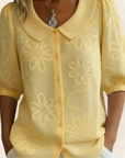 Jeanet – Blouse geborduurde bloemen