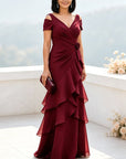 Marineblauwe maxi-jurk met open schouders, gelaagde chiffon en ruches