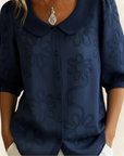 Jeanet – Blouse geborduurde bloemen