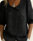 Jeanet – Blouse geborduurde bloemen