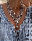 Lena | Blouse met stippenpatroon en vetersluiting