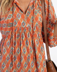 Amara | Midi jurk met V-hals en geometrisch patroon