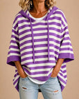 Meta | Gestreepte gebreide poncho met capuchon
