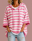 Meta | Gestreepte gebreide poncho met capuchon