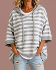 Meta | Gestreepte gebreide poncho met capuchon