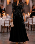Champagnekleurige maxi-jurk van chiffon en mesh met gouden pailletten, bloemenprint en 3/4-mouwen