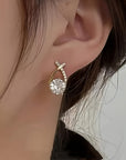 Oorbellen met gouden kruis en zirconia