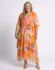 Calista | Maxi jurk van transparant materiaal met V-hals en gestrikte taille