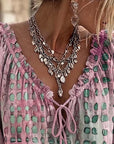Lena | Blouse met stippenpatroon en vetersluiting