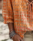 Lena | Blouse met stippenpatroon en vetersluiting
