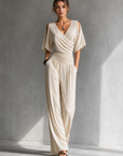 Feline | Elegante beige overslag jumpsuit