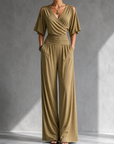 Feline | Elegante beige overslag jumpsuit