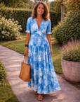 Ione | Mouwloze midi-jurk met bloemen en V-hals