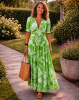 Ione | Mouwloze midi-jurk met bloemen en V-hals