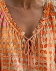 Lena | Blouse met stippenpatroon en vetersluiting