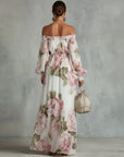 Witte maxi-jurk van chiffon met roze rozenprint en blote schouders