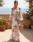 Witte maxi-jurk van chiffon met roze rozenprint en blote schouders