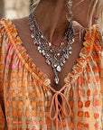 Lena | Blouse met stippenpatroon en vetersluiting