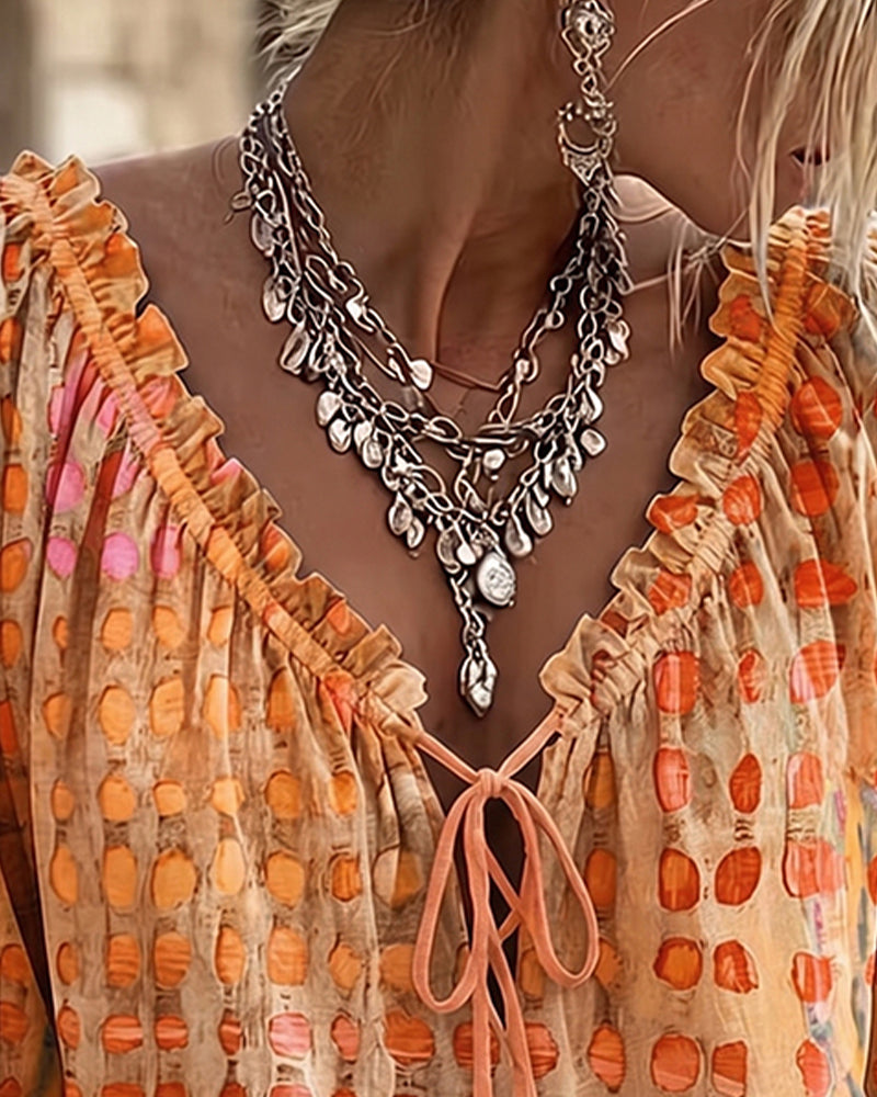 Lena | Blouse met stippenpatroon en vetersluiting
