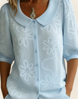 Jeanet – Blouse geborduurde bloemen