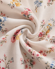 Dionne - Damesjurk met V-hals, bloemenprint en gedraaide taille