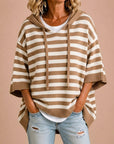 Meta | Gestreepte gebreide poncho met capuchon
