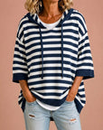 Meta | Gestreepte gebreide poncho met capuchon