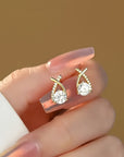 Oorbellen met gouden kruis en zirconia
