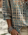 Lena | Blouse met stippenpatroon en vetersluiting