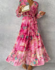 ZOEY | Levendige bloemen wikkeljurk met flatterende laagjes-silhouet