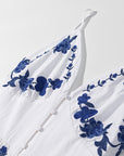 Thalina - Knielange Zomerjurk met blauwe borduurdetails