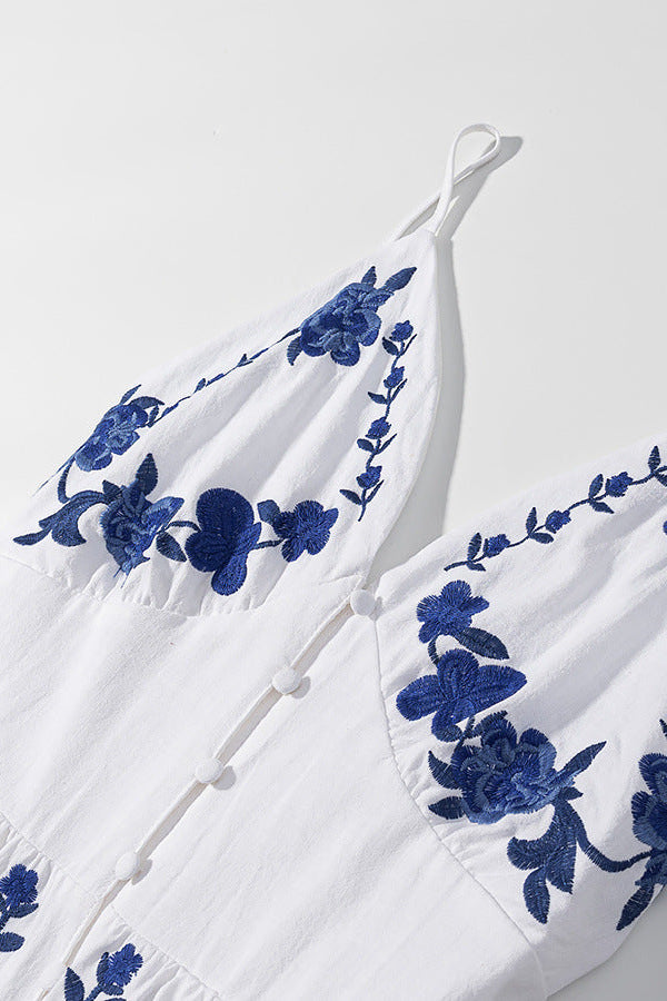 Thalina - Knielange Zomerjurk met blauwe borduurdetails