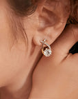 Oorbellen met gouden kruis en zirconia