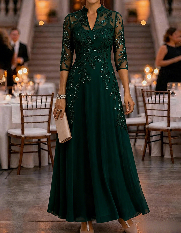 Champagnekleurige maxi-jurk van chiffon en mesh met gouden pailletten, bloemenprint en 3/4-mouwen