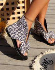 Quinty - Sandalen met platte zool en strik