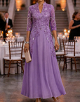 Champagnekleurige maxi-jurk van chiffon en mesh met gouden pailletten, bloemenprint en 3/4-mouwen