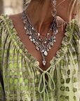 Lena | Blouse met stippenpatroon en vetersluiting
