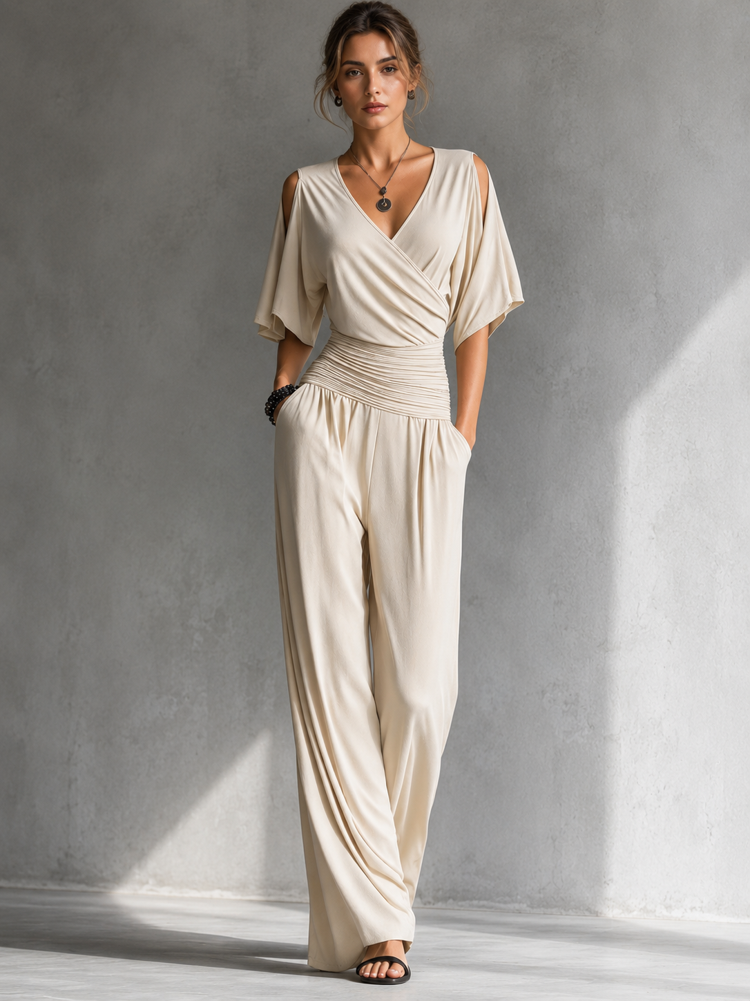 Feline | Elegante beige overslag jumpsuit