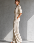 Feline | Elegante beige overslag jumpsuit