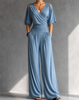 Feline | Elegante beige overslag jumpsuit